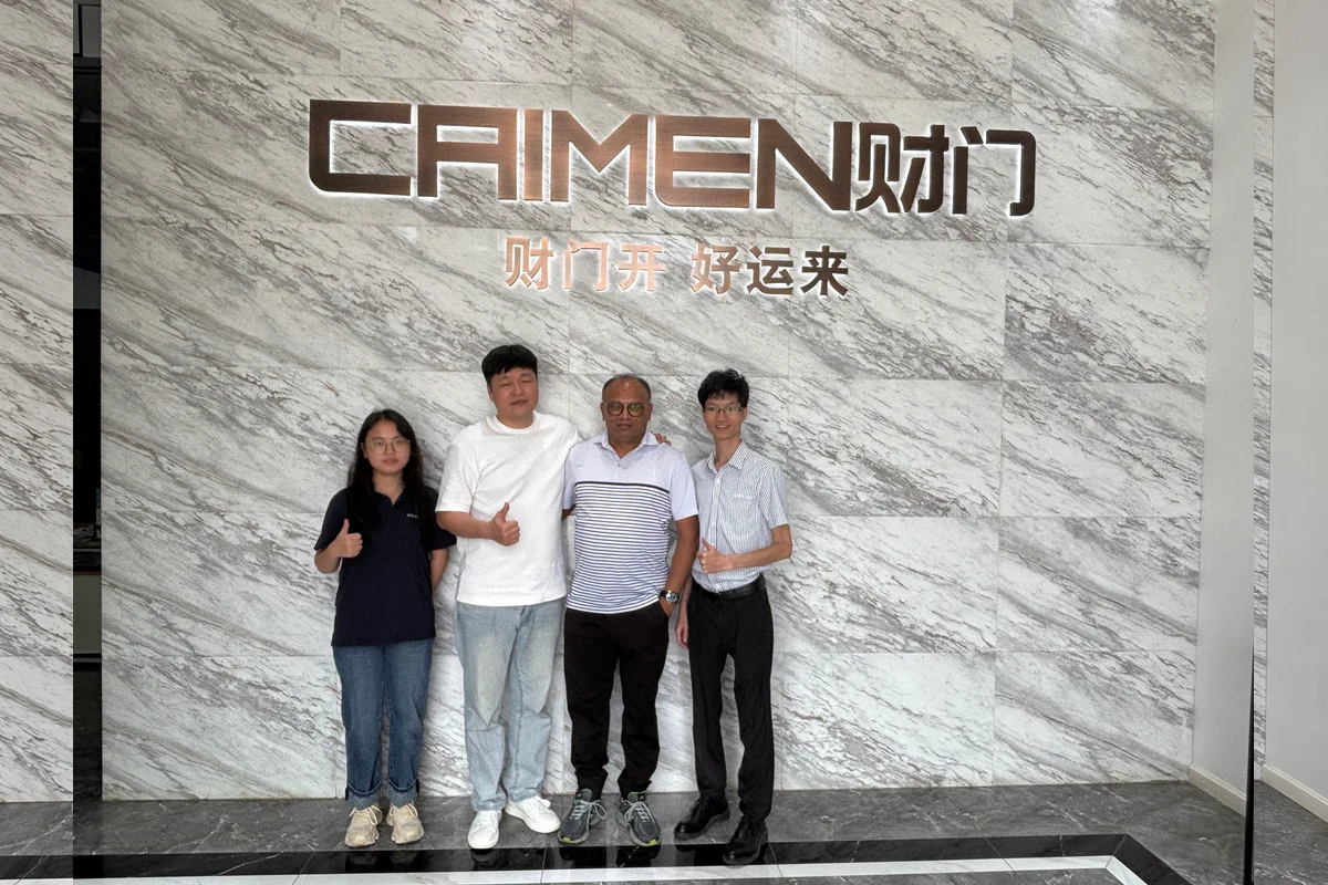 A group photograph with visitors at CAIMEN