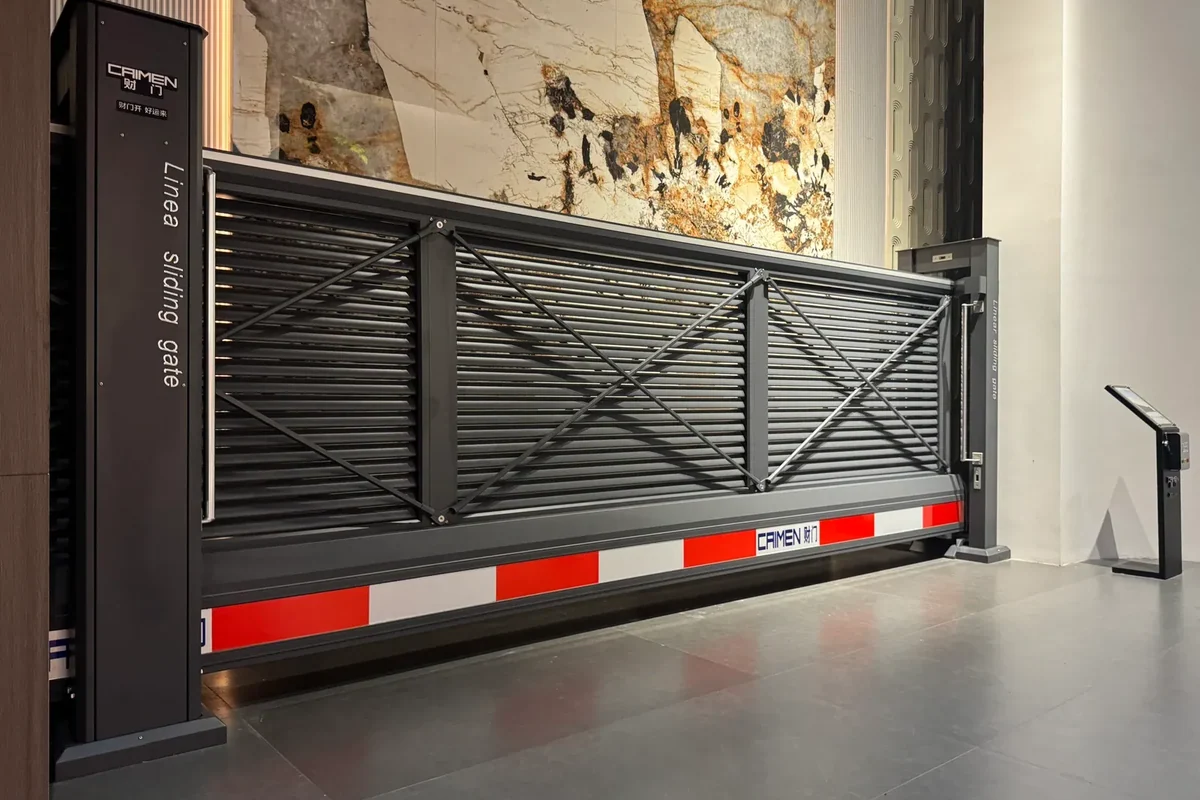 CAIMEN cantilever sliding gate with horizontal louvres on display in the showroom.
