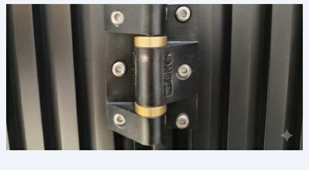 Close view of the connecting hinge on a CAIMEN sectional gate.