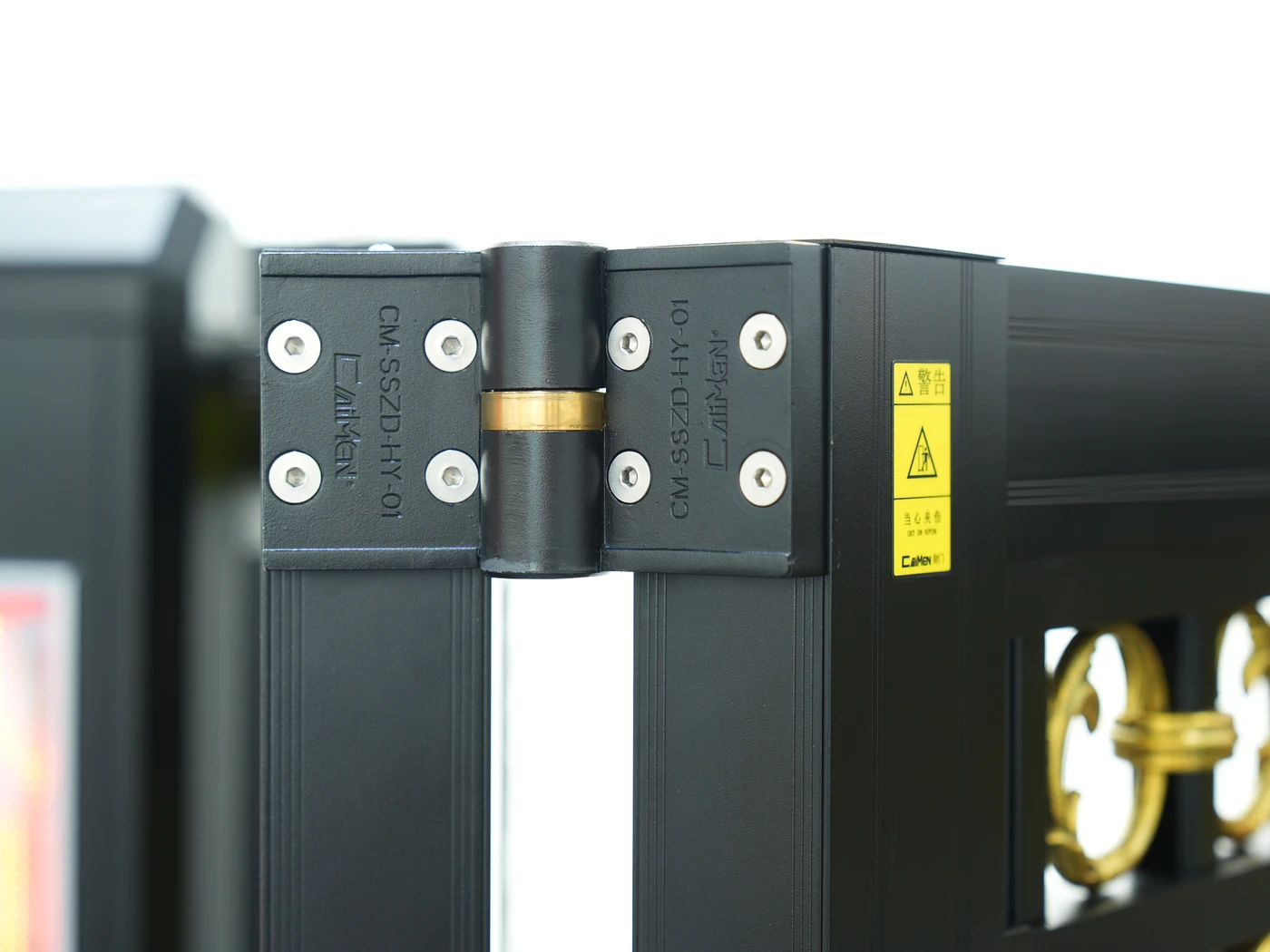 Close view of the connecting hinge on a CAIMEN bi-folding gate in the showroom.