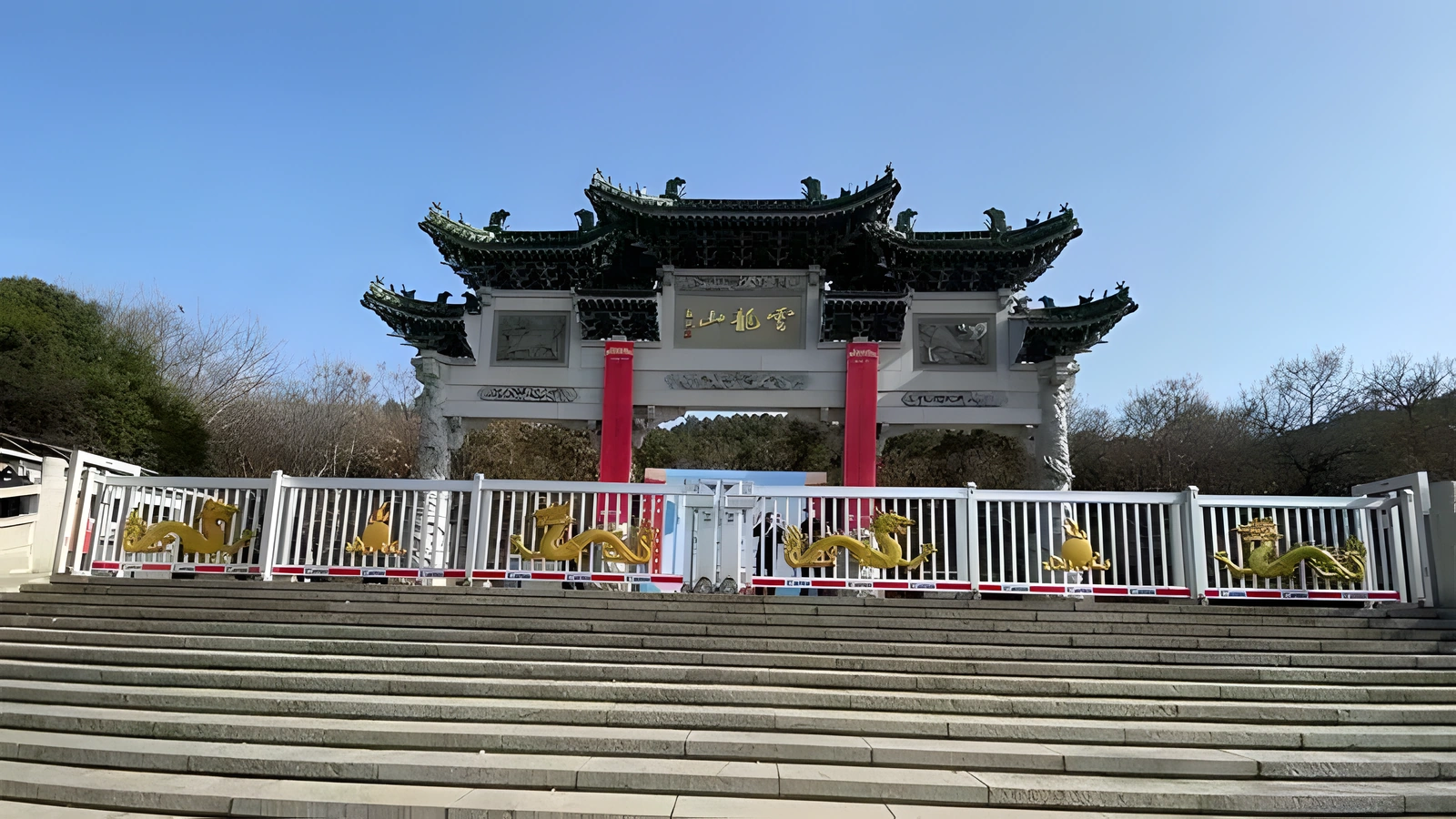 Decorative telescopic gates installed at a scenic park entrance